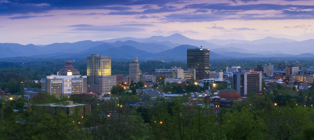 AVL skyline purple sunset - Venture Asheville